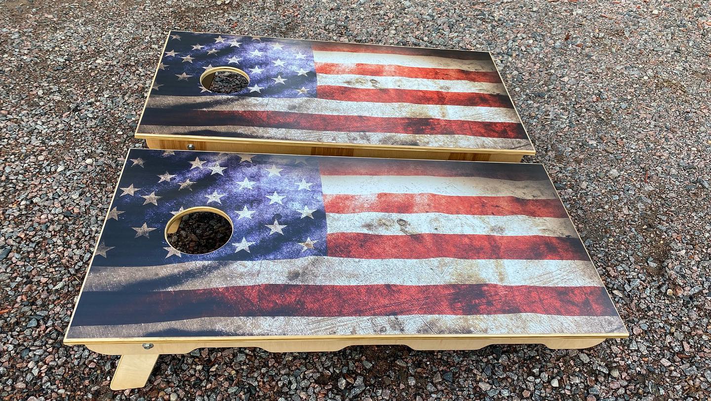 Faded wave flag cornhole set