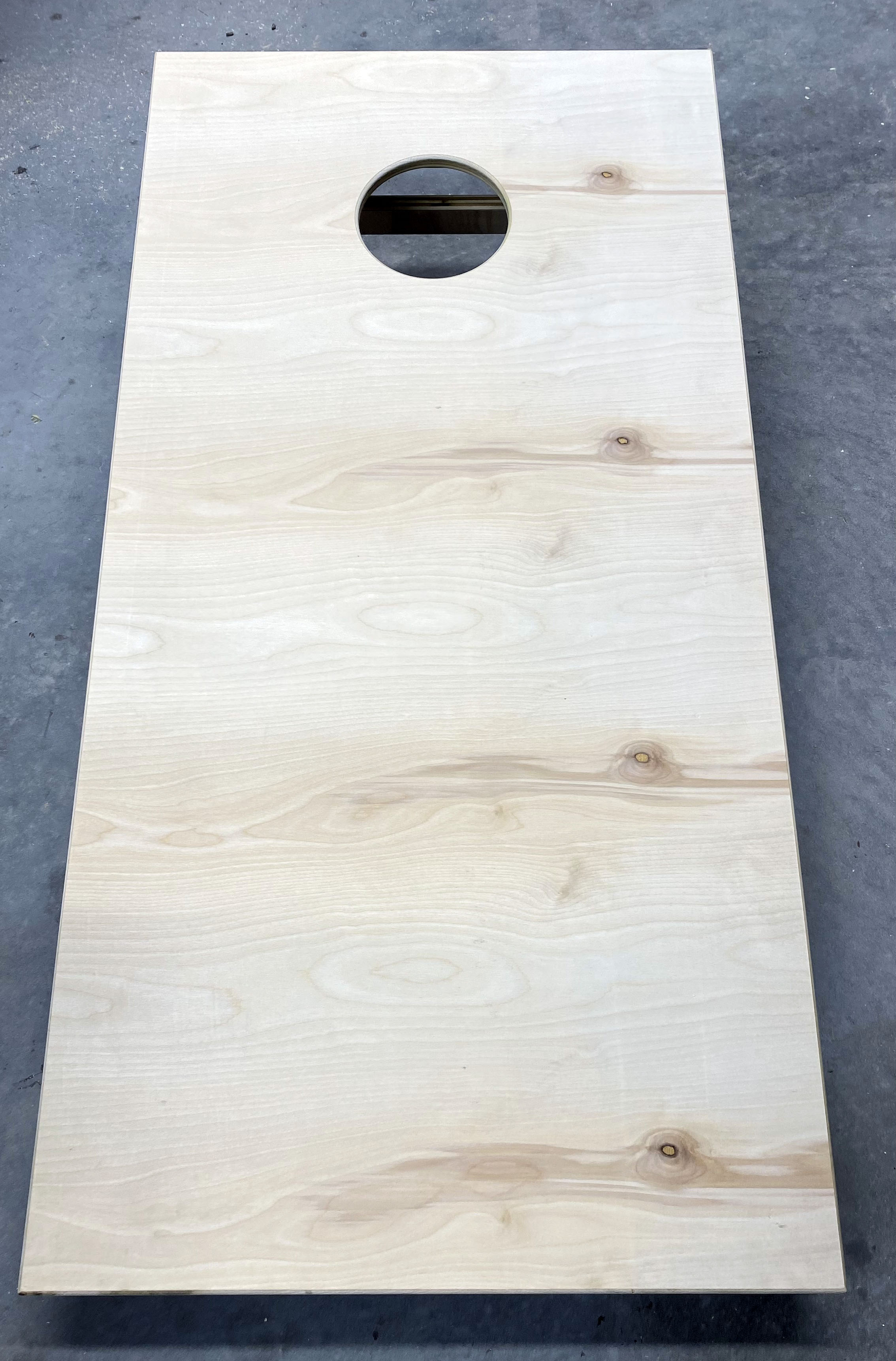 Assembled unfinished cornhole board before finishing